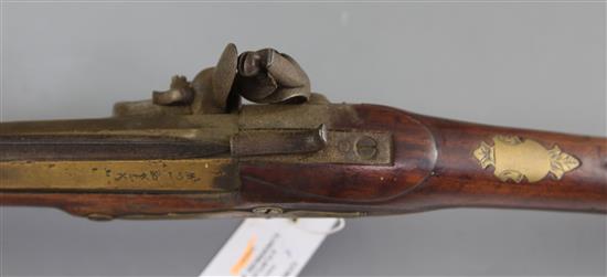 A late 18th century flintlock blunderbuss with sprung bayonet and brass barrel, 29in.